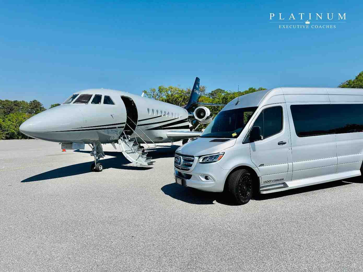 Platinum Executive Coaches Mercedes sprinter beside a private jet on the tarmac — chauffeured airport transfers serving Beaufort, SC